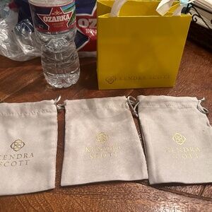3 Kendra Scott dust bags and 1 small shop gift bag